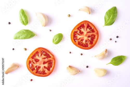 Fototapeta Naklejka Na Ścianę i Meble -  Composition with fresh garlic, basil leaves, tomato and peppercorn