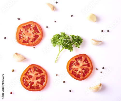 Composition with fresh garlic, basil leaves, tomato and peppercorn