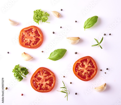 Composition with fresh garlic, basil leaves, tomato and peppercorn