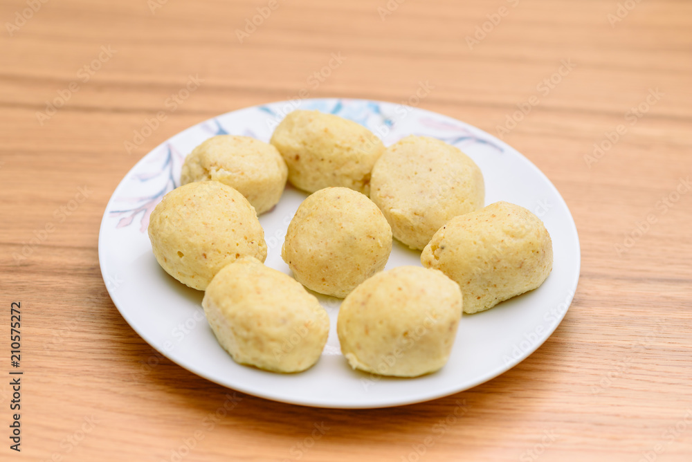 Traditional matzoh ball (kneidlach) for soup.White platel with authentic matzo ball for chicken taste hot soup ( bouillon ) tradition Jewish food for Passover and every day. Traditional matzoh ball (kneidlach) for soup.White platel with authentic matzo ball for chicken taste hot soup ( bouillon ) tradition Jewish food for Passover and every day.