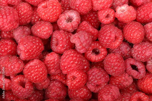 Juicy and fresh ripe raspberries close-up. Natural background