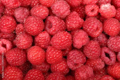 Juicy and fresh ripe raspberries close-up. Natural background