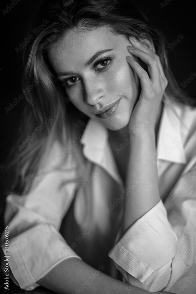 Classic portrait of sensual young woman in a simple clothes. Emotional close-up photo Classic portrait of sensual young woman in a simple clothes. Emotional close-up photo