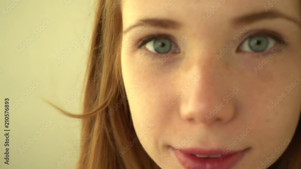 Positive red-haired girl smiles Positive red-haired girl smiles