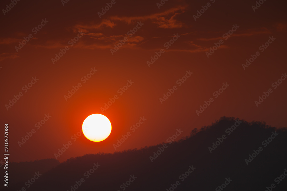 Colorful sky of sunrise above mountain on cloudy at winter season Colorful sky of sunrise above mountain on cloudy at winter season