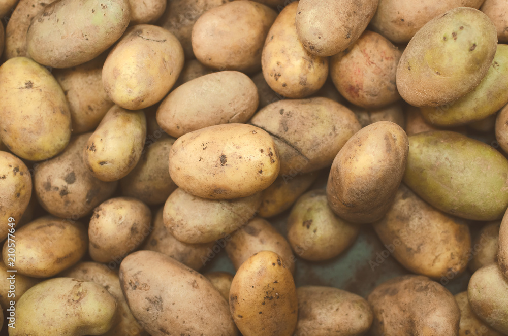 Raw potatoes textre background, top view. Raw potatoes textre background, top view.