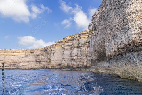 Dwejra, the island of Gozo, Malta. Sheer rocks on the beach