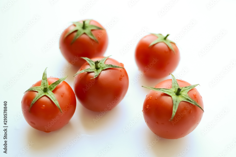 Tomatoes isolated on white. Tomato with drops