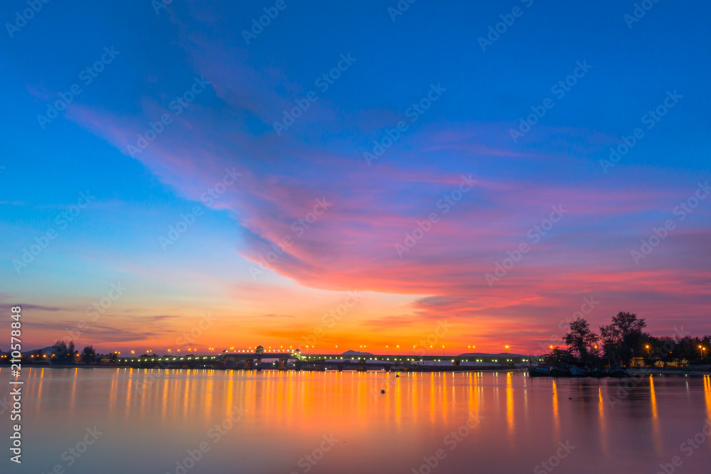 Fototapeta premium scenery sunrise above Sarasin bridge. fishing boats parking on the Sarasin beach. Sarasin bridge linking the province of Phang Nga and Phuket.