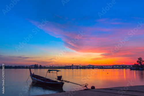 scenery sunrise above Sarasin bridge. fishing boats parking on the Sarasin beach. Sarasin bridge linking the province of Phang Nga and Phuket.