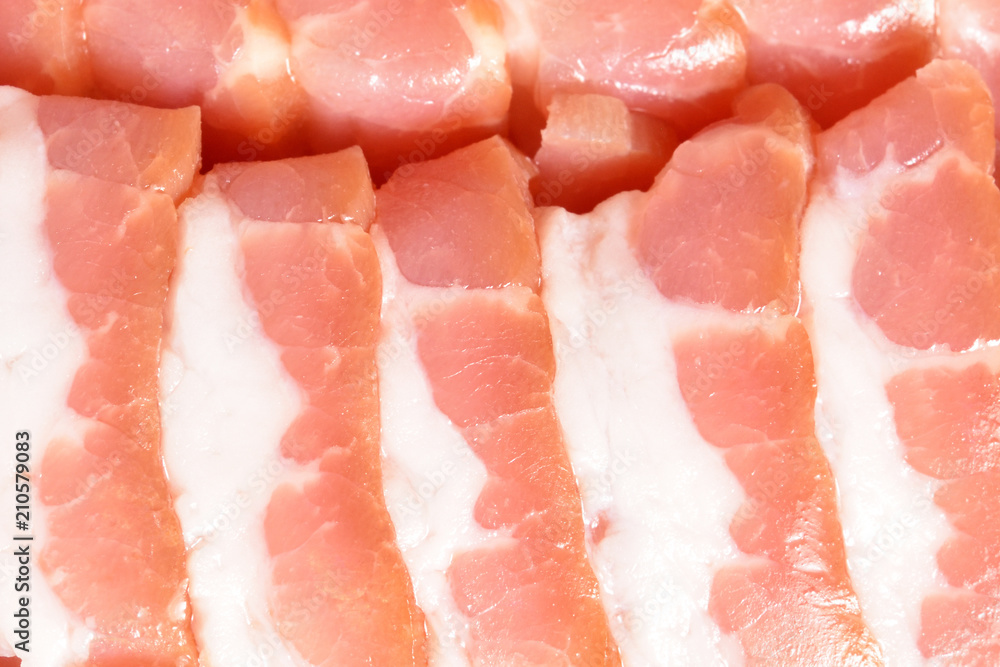 Beautiful sliced bacon. Sliced bacon smoothly laid close-up