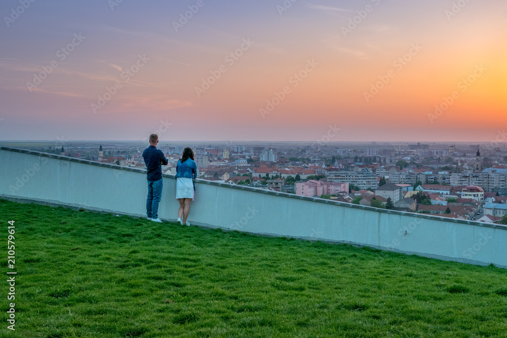 Fototapeta premium Couple wathing the sunset in Oradea from Mushroom Hill in Romania