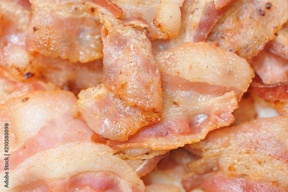 Beautiful and fried bacon brown, very appetizing, close-up Beautiful and fried bacon brown, very appetizing, close-up