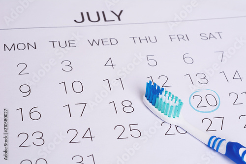 Calendar and toothbrush.
