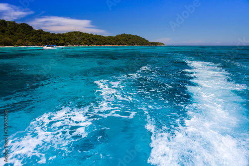 Clear wave of sea with background of mountain under clear sky at ocean in Tropicana located south of thailand