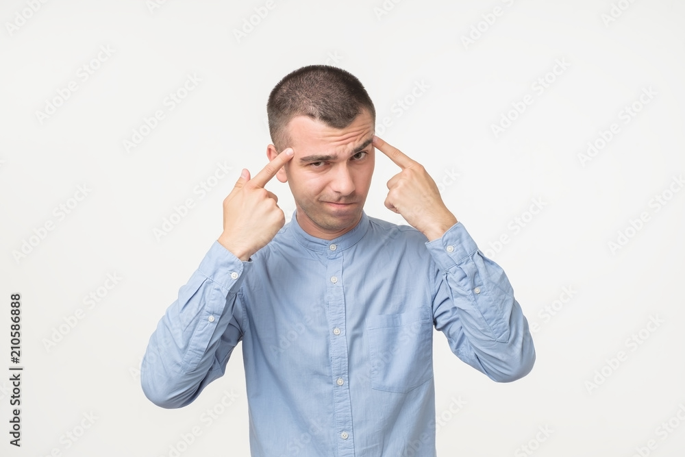 Handsome hispanic man tries to concentrate and remember some details. Handsome hispanic man tries to concentrate and remember some details.