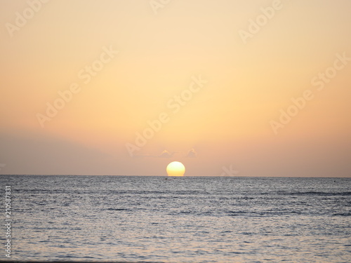 sunset at the horizon of the ocean