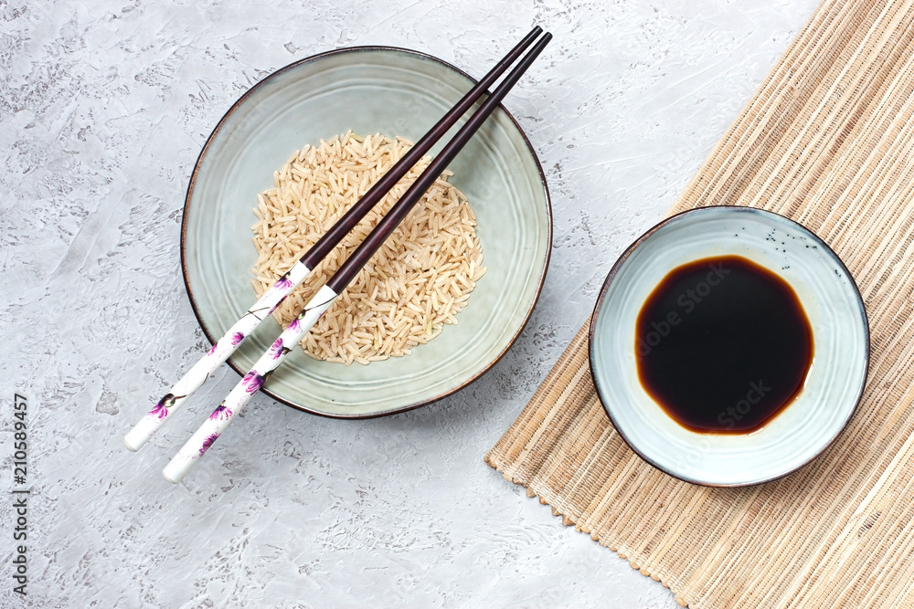 Asian style ceramic bowl and chopstick on gray background. Top view Asian style ceramic bowl and chopstick on gray background. Top view