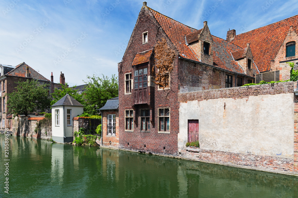 Ancient houses on the bank of the channel in Bruges, Belgium.