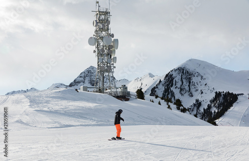 A transmitter at the top of a mountain in the Dolomites ski area. Empty ski slope in winter on a sunny day. Prepare ski slope  Alpe Cermis  Italy