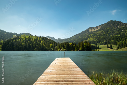 A long time exposure at the Spitzingsee with a view to the mountains
