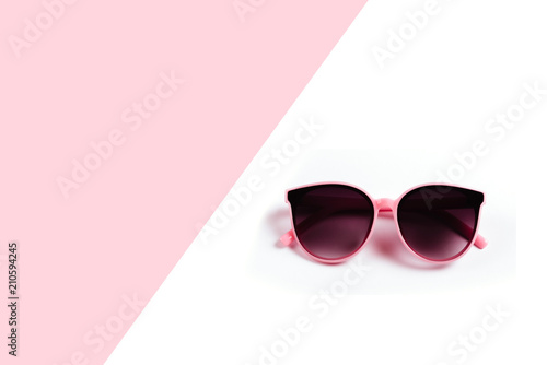 sunglasses isolated on a pink and white background