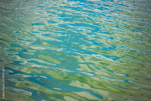 Fotografija soft focus colorful blue and green water surface with small waves concept and em