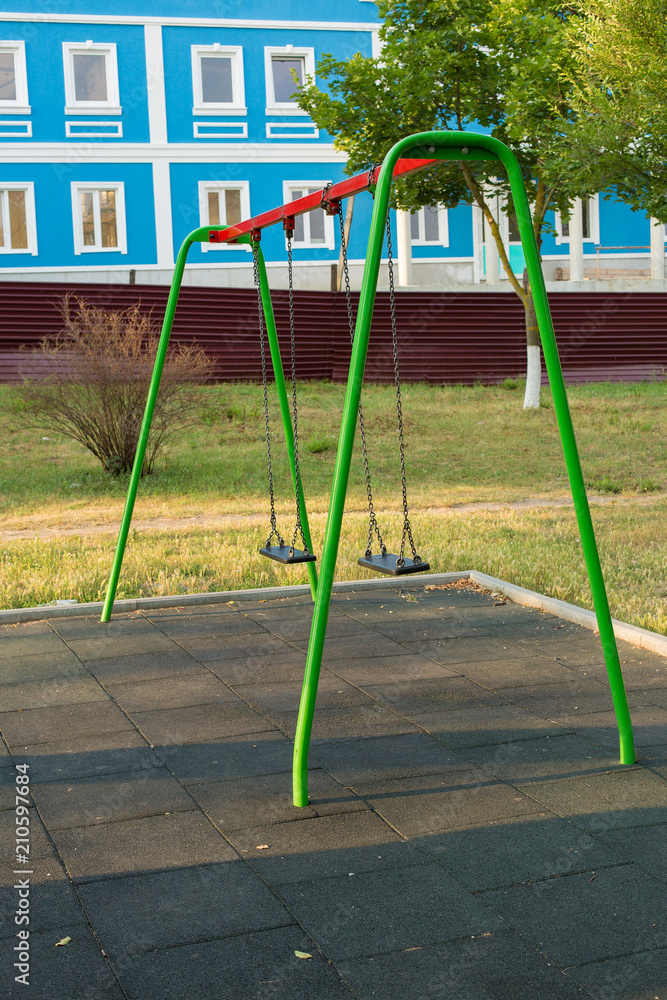 Children's entertainment complex, childhood, Child on a swing	
