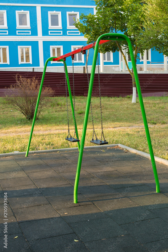 Children's entertainment complex, childhood, Child on a swing Children's entertainment complex, childhood, Child on a swing