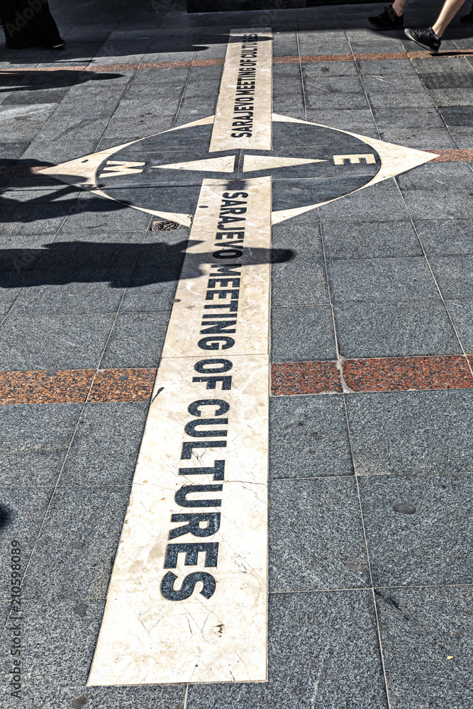 Fototapeta premium West and East Meeting of Cultures sign at Ferhadija Street in Sarajevo, Bosnia and Herzegovina.