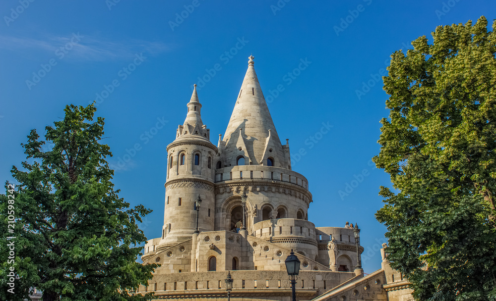 fairy tale white beautiful castle palace facade with towers on blue background in summer time bright colorful day