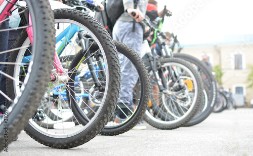 Bicycle wheels. A group of cyclists. Bicycle tour