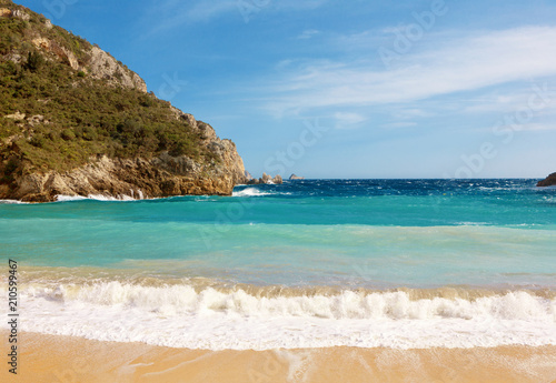 Beautiful sandy beach in a bay at Paleokastritsa in Corfu, Greece