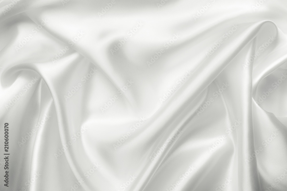 Elegant white satin silk with waves, abstract background