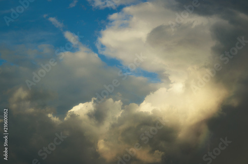 A blue cloudy day sky with beautiful clouds for the designer's background © DiKiYaqua