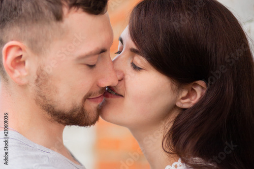 Closeup photo of kissing couple