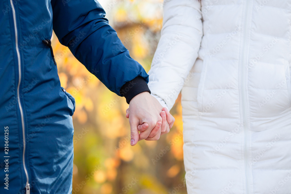 Closeup photo of couple, holding hand in hand