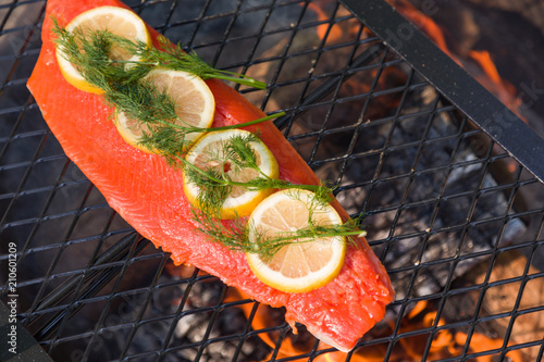 Fillet Of Salmon With Lemon Slices on Outdoor Grill