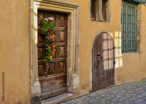 Composition of autumn flowers on a wooden door