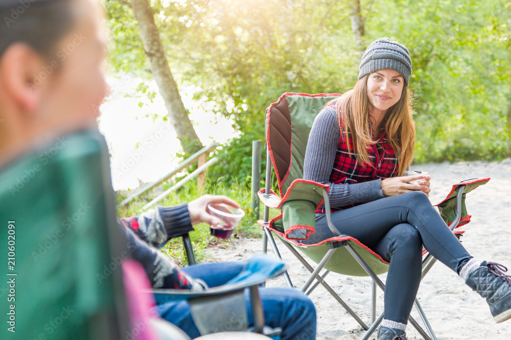 Attrractive Young Adult Female Enjoying Talking With Friends at Campground