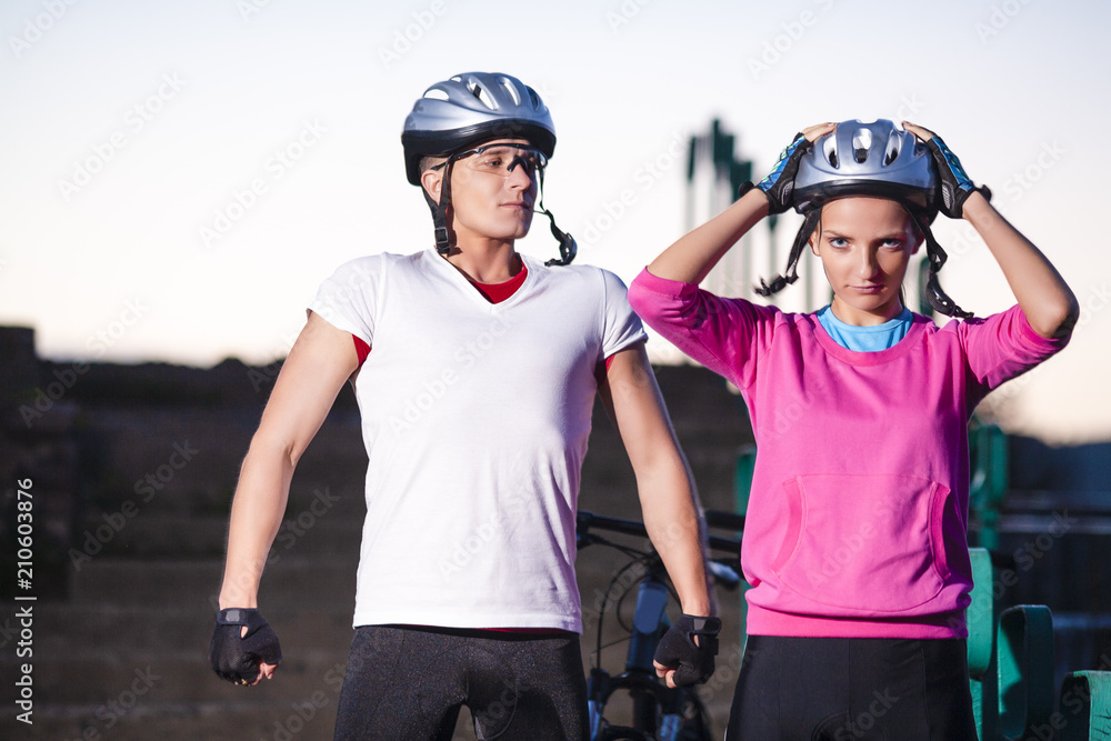 Two Mountain Bikers Posing Together Outdoors Two Mountain Bikers Posing Together Outdoors