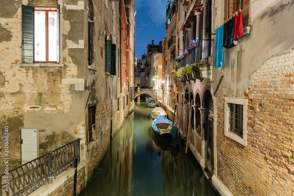 View over a picturesque canal at night, Venice, Italy