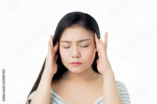 The woman is touching her head to show her headache. Causes may be caused by stress or migraine.