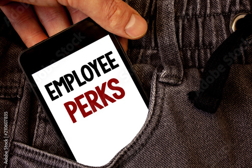 Text sign showing Employee Perks. Conceptual photo Worker Benefits Bonuses Compensation Rewards Health Insurance Text two words on white screen black Phone Hand holding grey jeans pocket.