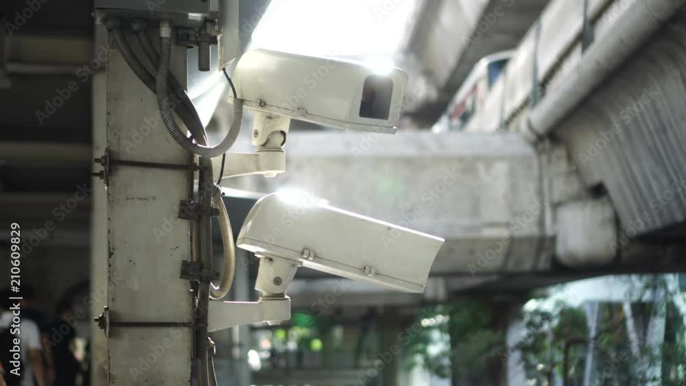 City cctv surveillance over street, people and public traffic video 4k City cctv surveillance over street, people and public traffic video 4k