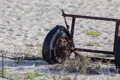A wheel rusts away on Suma Beach, Japan.