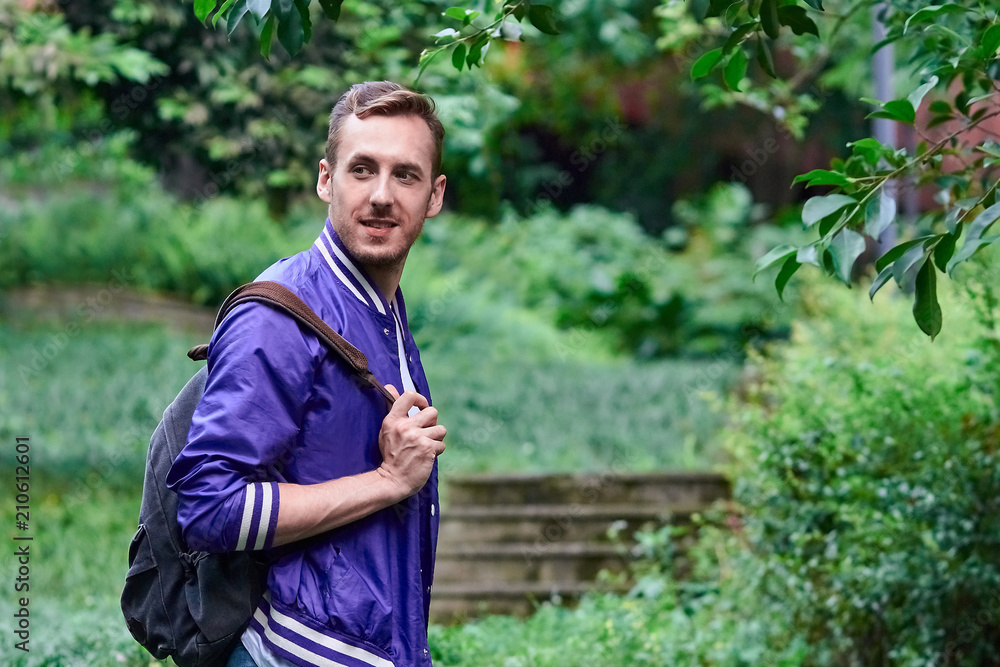 Man traveling in the forest with backpack Man traveling in the forest with backpack