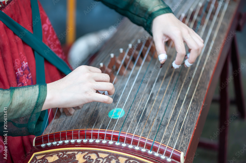 Chongqing, China - June 13, 2018 : Woman playing Guzheng traditional ...