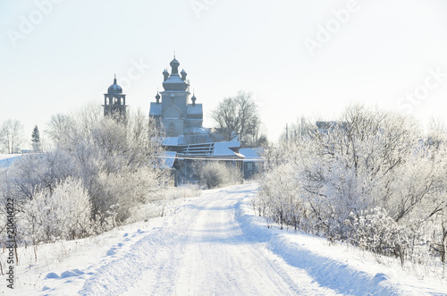 Wallpaper Mural Змний пейзаж с Преображенской церковью (XVIII в.) в Турчасове зимой в солнечный день. Россия, Архангельская область, Онежский район Torontodigital.ca