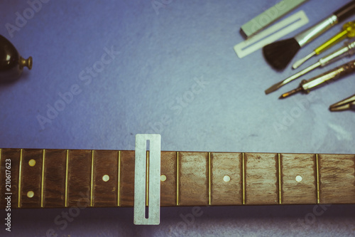 electric guitar on guitar repair desk